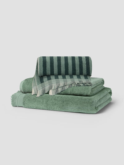 Stack of Pine Green Pembroke Stripe and Moss Green Fringe Edge Towels