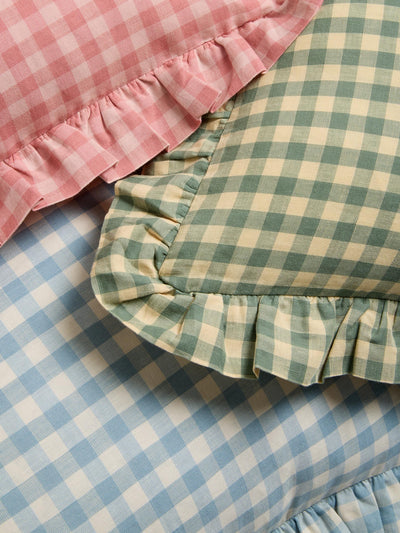 Close-up of Frill Gingham Cushions with pink, green, and blue gingham.